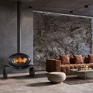 Suspended wood-burning fireplace on steel stand in contemporary lounge with textured stone feature wall.